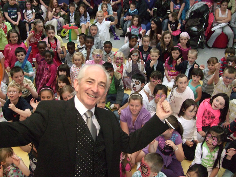 Pat Fallon performing for children