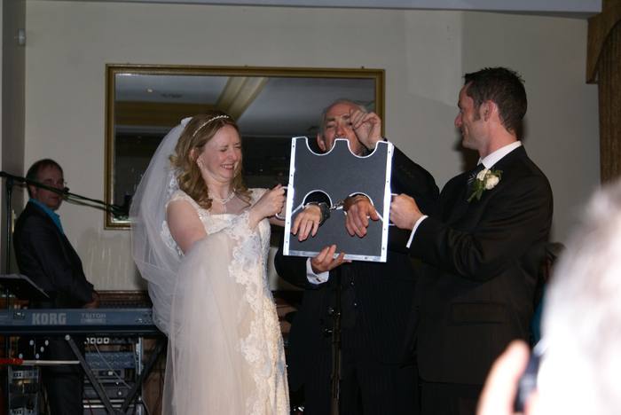 Pat Fallon performing magic at a wedding reception